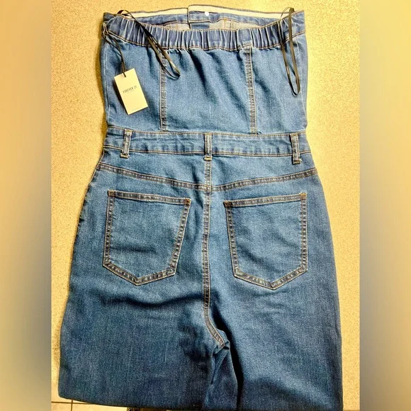 Stretchy Blue Denim Jumpsuit With Silver Buttons And Pockets - Picture 3 of 7